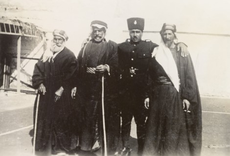 Palestinian police officer with 'mukhtars'. An officer of the Palestine Police Force poses for a