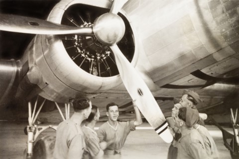 Propeller of a Royal Dutch Airlines aeroplane. European servicemen inspect the propeller of a KLM