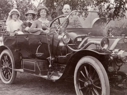 Driving an Itala car, India. Three European women and their male companion take a spin in a