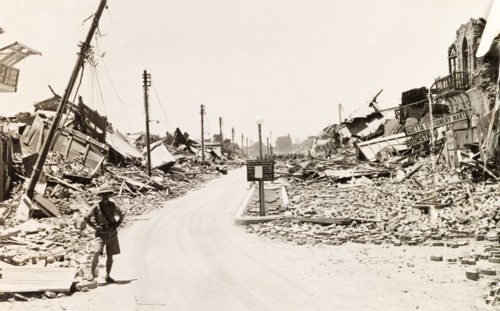 Earthquake damaged street in Quetta. A European man stands on a devastated street in Quetta,