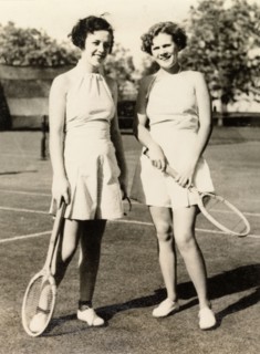 Playing tennis, Calcutta, 1935. Two American women, Mildred and Helen, pose with their racquets on