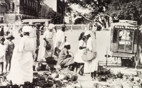 Roadside market, Barbados. Street traders sell pots and jugs at a roadside market stall in