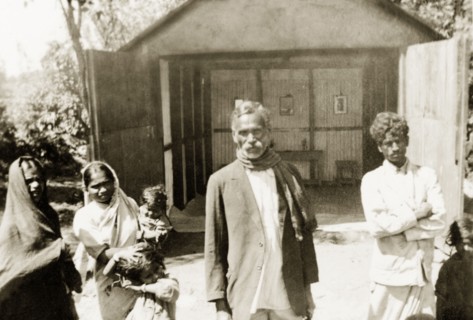 Church at Indian coffee estate. Plantation workers at 'Maskal Maradi' coffee estate stand outside a