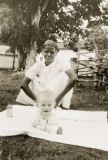 Indian ayah with baby Nell. An Indian ayah (nursemaid) watches over a six month old baby, Nell