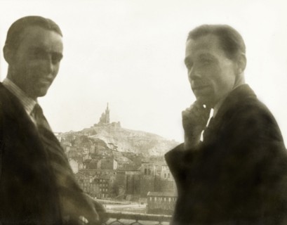 Visiting Marseille. Two British men pose whilst looking over the city of Marseille, where the