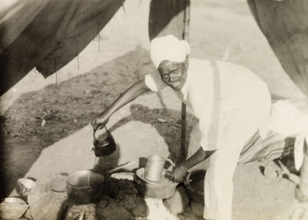 Methodist missionary camp site. A Methodist evangelist called Simon pours water from a kettle into