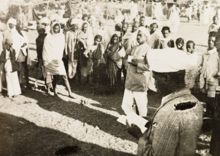 Evangelist preaching to villagers. Methodist evangelist R. Christadas preaches to a gathered crowd
