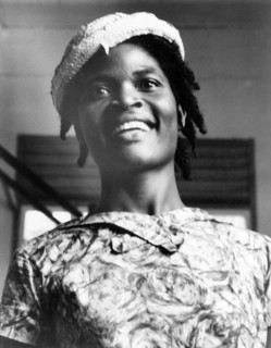 Portrait of a Grenadian woman. Head and shoulders portrait of a young Grenadian woman, dressed