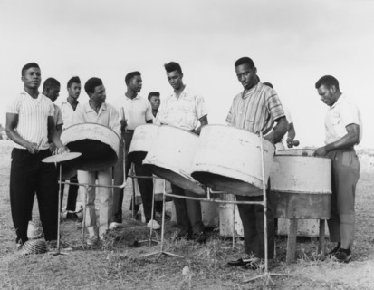 A steel band in Basseterre. A group of young men play converted petrol drums in a steel band.