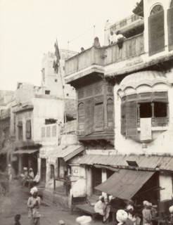 Street scene in Lahore. View of a shop-lined street in Lahore, taken from the back of an elephant.