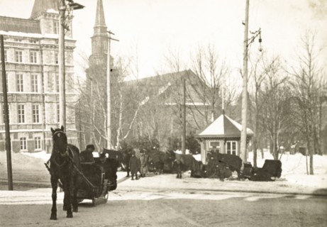 A horse-drawn sledge, Quebec. A horse-drawn sledge travels along a snow covered street in Quebec