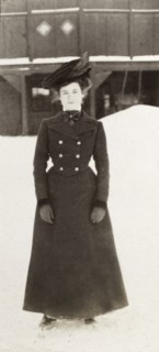 Annie Evan ice skating. Full-length portrait of Annie Evan, who pauses for the camera whilst ice