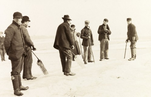 Ice cutters on Lake Ontario. A team of ice cutters, ice saws in hand, prepare to remove ice from