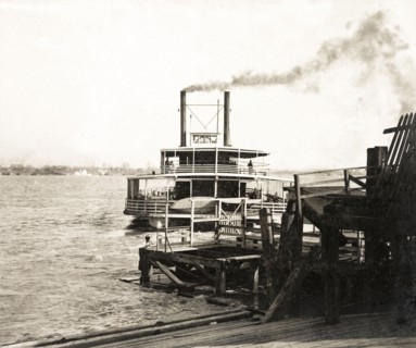Cargo ship departing New Orleans. A cargo steamship departs a New Orleans wharf after delivering a