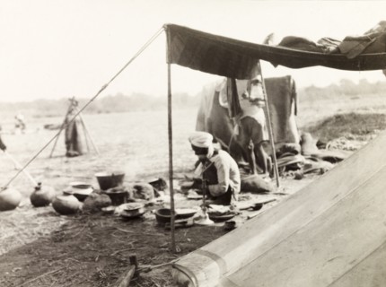 Mahouts camp at Coronation Durbar, 1903. Off-duty mahouts (elephant handlers) relax and cook