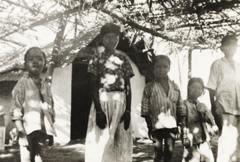 Mission school at 'Maskal Maradi' coffee estate. Children stand under a covered courtyard outside