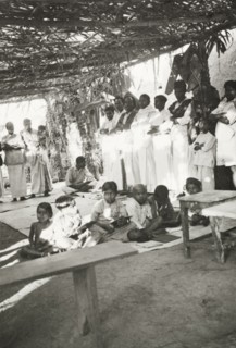 Night school at 'Maskal Maradi' estate. Children attend a night school class at a Methodist mission