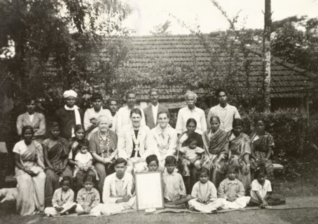 Reverend and congregation at Indian plantation. British missionary Reverend Norman Sargant (centre)