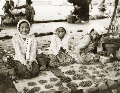 Girls selling chilli peppers in Bali. Three young Balinese girls sell chilli peppers at a village