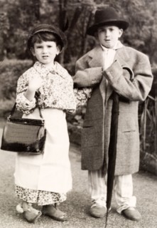 Two brothers dressed up as their parents. Two young brothers, Clive (right) and Tim, dress up in