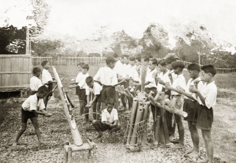 Schoolchildren washing at Keningau Health Centre. Schoolchildren wash their hands and clean their