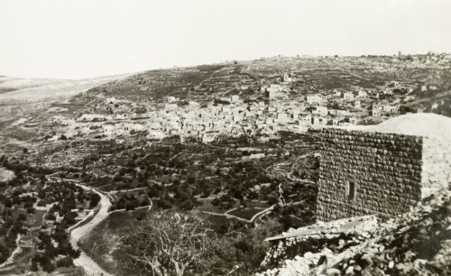 The village of Lifta, circa 1938. A twisting road winds its way down a hillside beneath the Arab