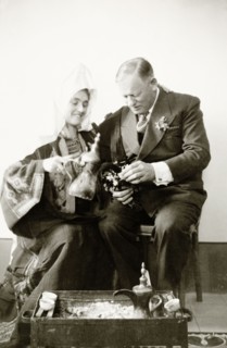 Portrait of Mr and Mrs Keith-Roach . Edward Keith-Roach, District Governor of Jerusalem, holds out