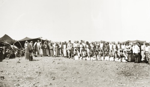 A meeting with Arab leaders. Two British officials pose for a group portrait with Arab leaders