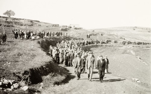 William Ryder McGeagh with Arab villagers. William Ryder McGeagh (centre), District Commissioner in