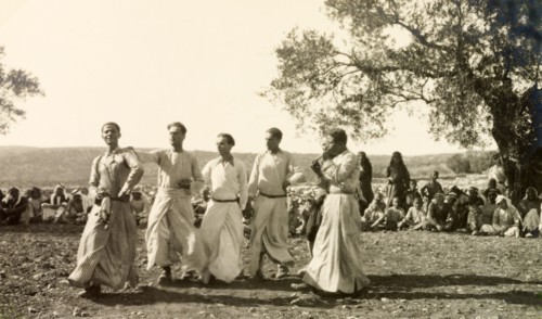 Dabke' dance at a Palestinian wedding. A group of men dressed in 'thobs' (ankle-length garments