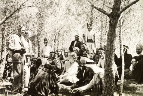 British officials meet Arab mukhtars . British officials talk to Arab mukhtars (headmen) in a