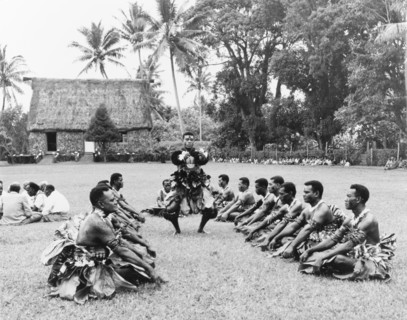 Preparations for a 'sevusevu' ceremony. A group of Fijian men perform an elaborate dance before a