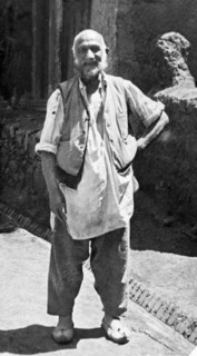 A Kashmiri 'dhobi'. Full-length portrait of a Kashmiri dhobi' (laundryman) dressed in a loose