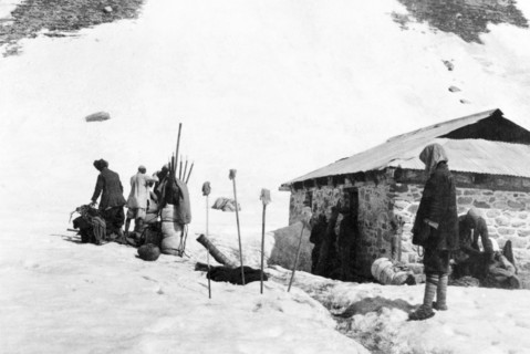 Equipment check on Sheshnag Mountain. A group of mountain guides organise their equipment at a camp
