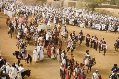 The Emir of Kano rides into the Residency. The new Emir of Kano, Alhaji Ado Bayero, rides into the