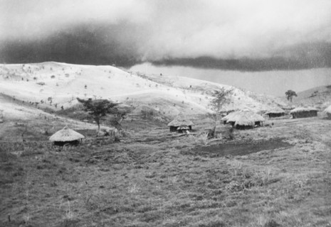 Storm clouds over Lumbwa. Storm clouds gather over a small valley settlement in the hills. Near