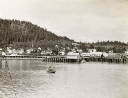 Wrangell pier, Alaska. A wooden pier stretches into the waters of the Zimovia Strait at the coastal