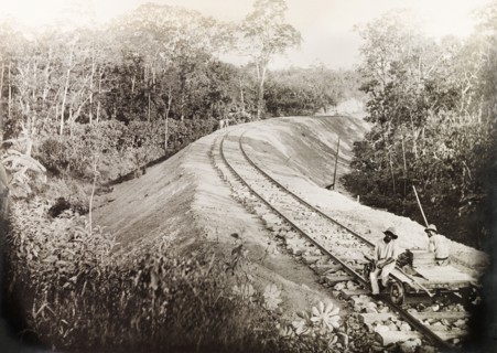 A newly completed section of the Siparia line. Two Trinidad Government Railway workers sit on a