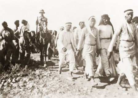 Marching Palestinian Arabs to a detention centre. British soldiers march a group of Palestinian