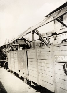 Railway guard carriage, Palestine. British soldiers armed with light mortar travel inside a railway