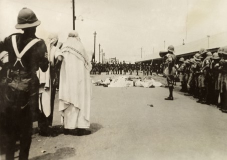 Casualties in Palestine, circa 1938. A British Army officer uses a loudhailer to address his troops