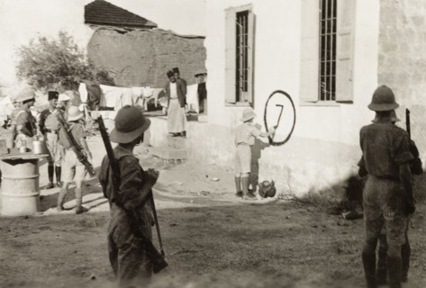 Royal Engineers mark a house for demolition. British soldiers of the Royal Engineers mark a