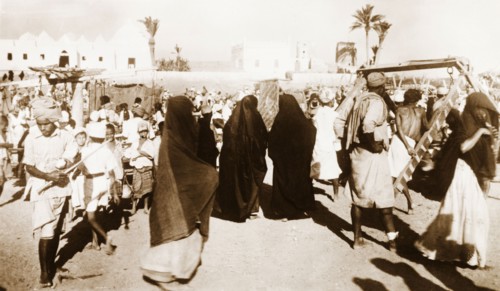 Muslim women at Sheikh Othman. Women wearing traditional Muslim burqas move amongst the crowds at a