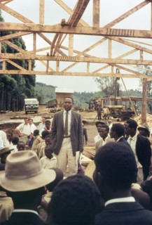 Mr Bitware speaks at Mafuga sawmill. Mr J. Bitwari addresses a crowd of Ugandan chiefs, villagers