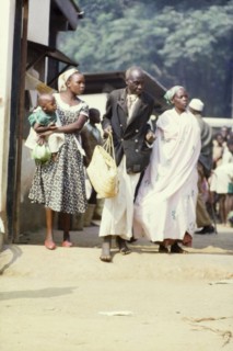 A Batoro family at Mpanga market. Members of a well-to-do Batoro family shop at Mpanga market in