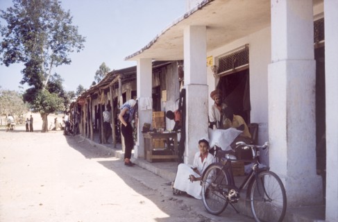 Dukas on the Tanganyika-Uganda road. A row of typical East African dukas (shops) flanks the