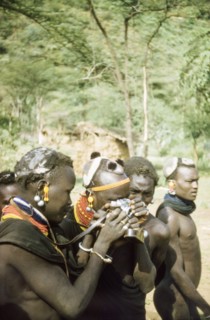Henry Osmaston's Leica'. Suk (Pokot) porters working with a British forestry survey team experiment