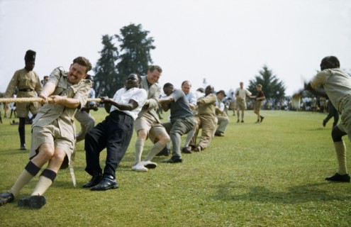 Tug of war in Toro. British and Ugandan men of the Protectorate Police team take part in a tug of