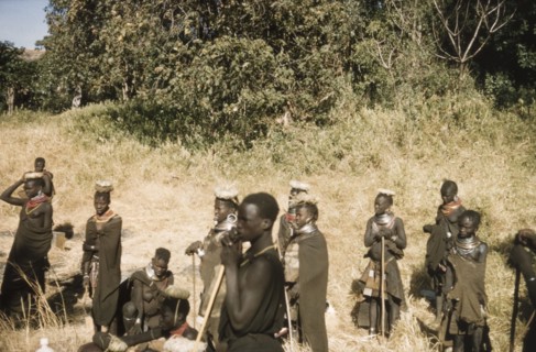 Porter's wives on a safari to Mount Napak. A group of porter's wives, wearing head pads and