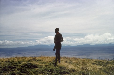 Porter on the summit of Mount Napak. A porter working with a British forestry survey team stands